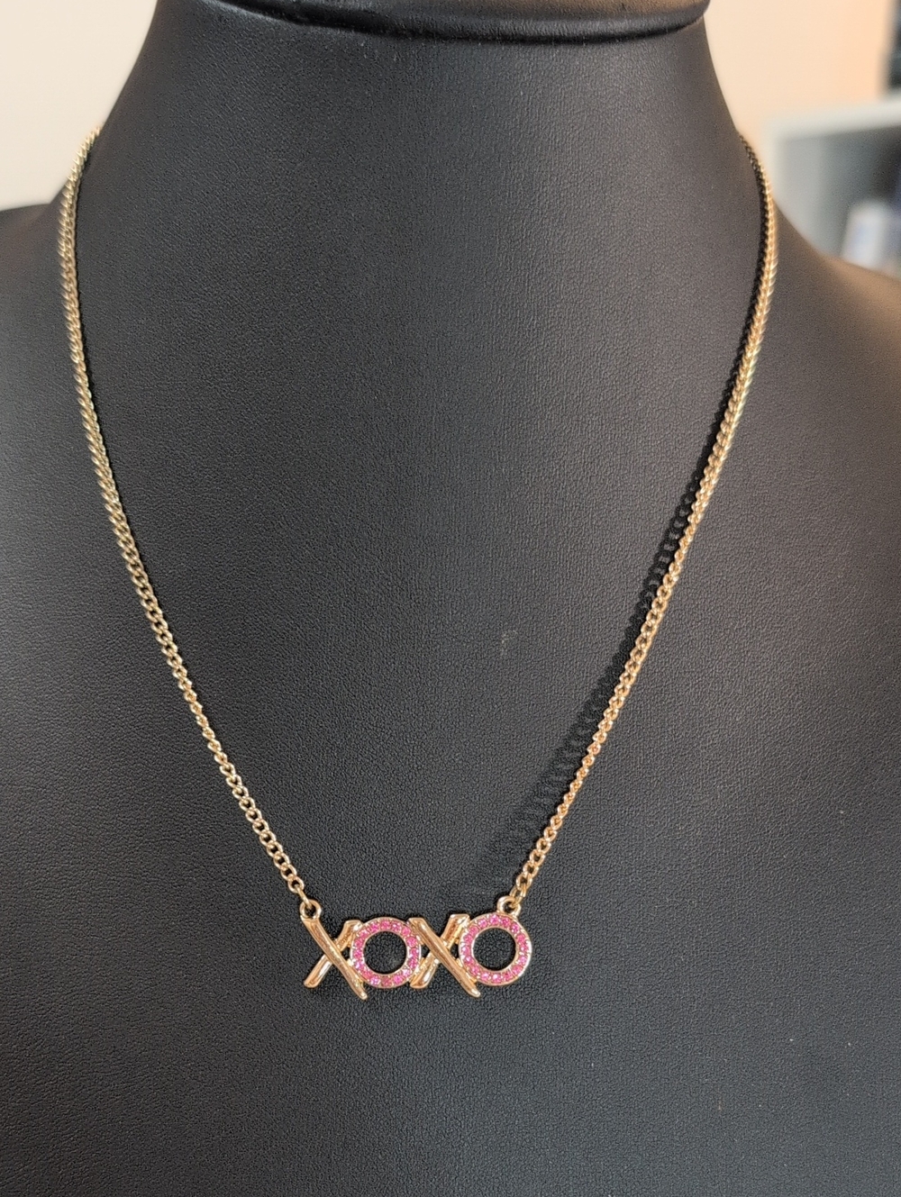 Gold Tone XOXO Necklace with Pink Crystal Accents